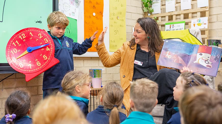 Young teacher in a classroom with students