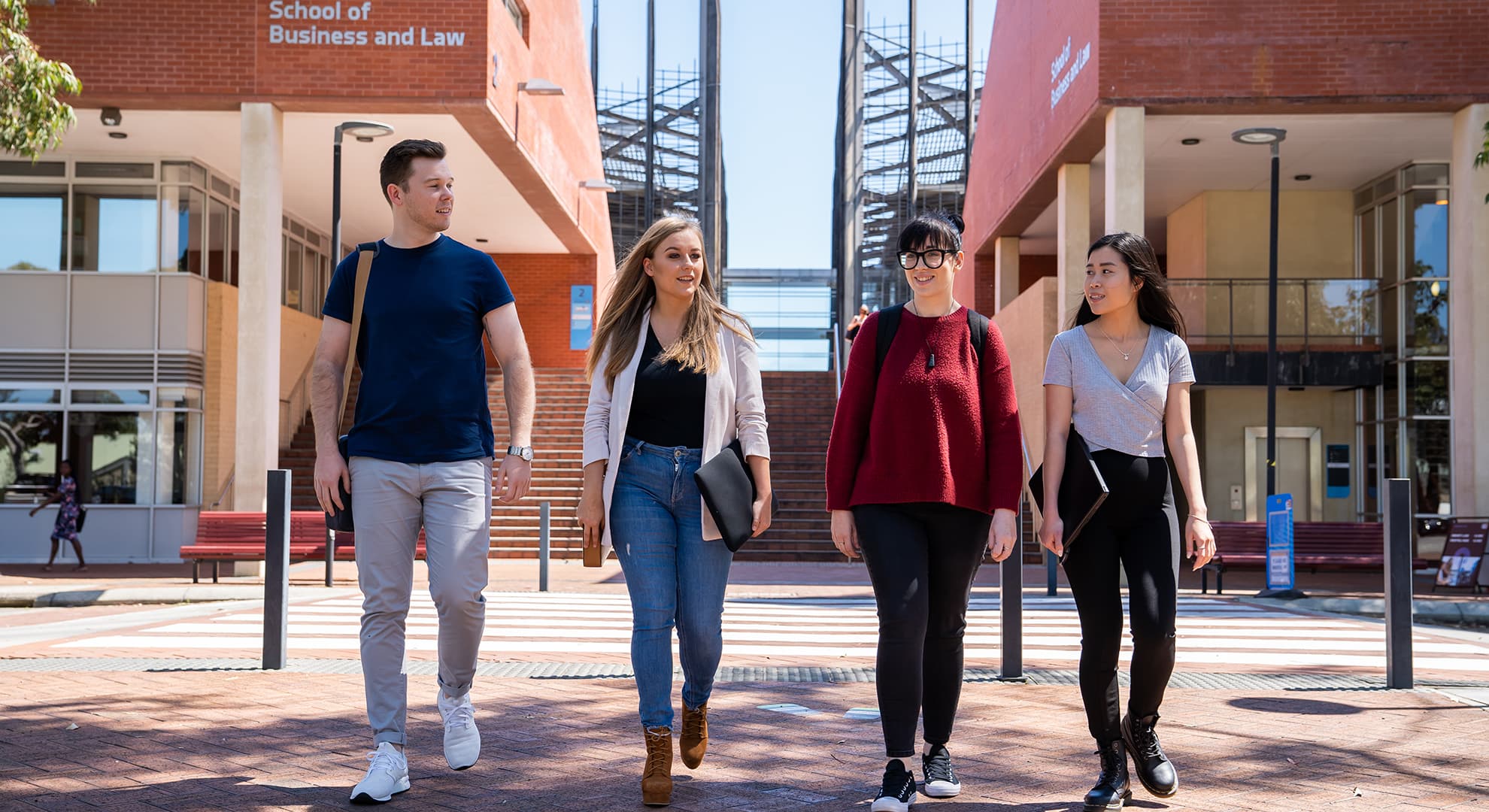 Students walking in front of School of Business and Law building