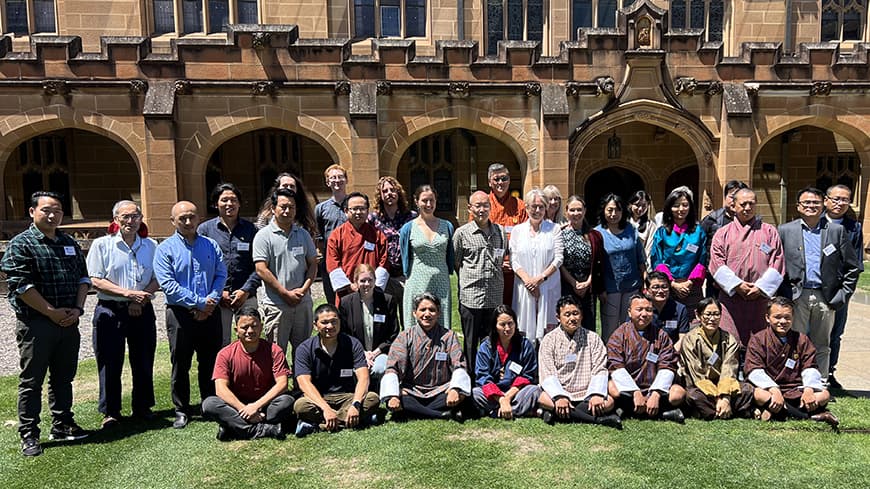 A group of ECU delegates standing in front of The University of Sydney.