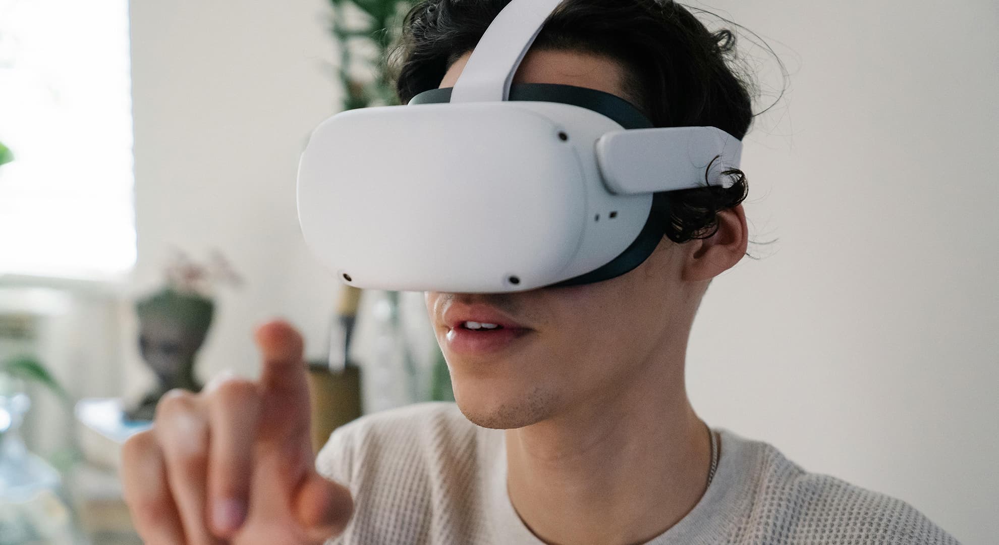 Young man wearing a VR headset.