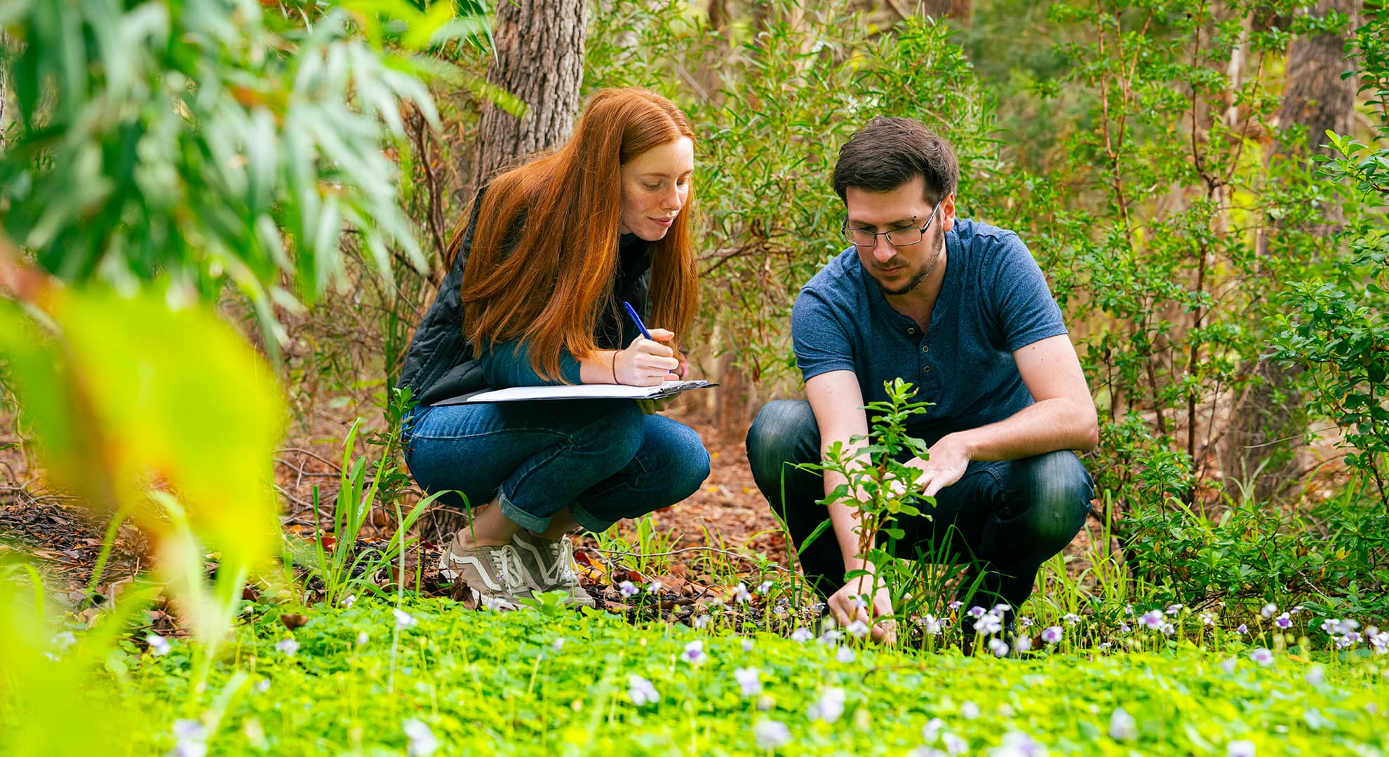 ECU Science student Madison Martin at work with a peer on a field trip.