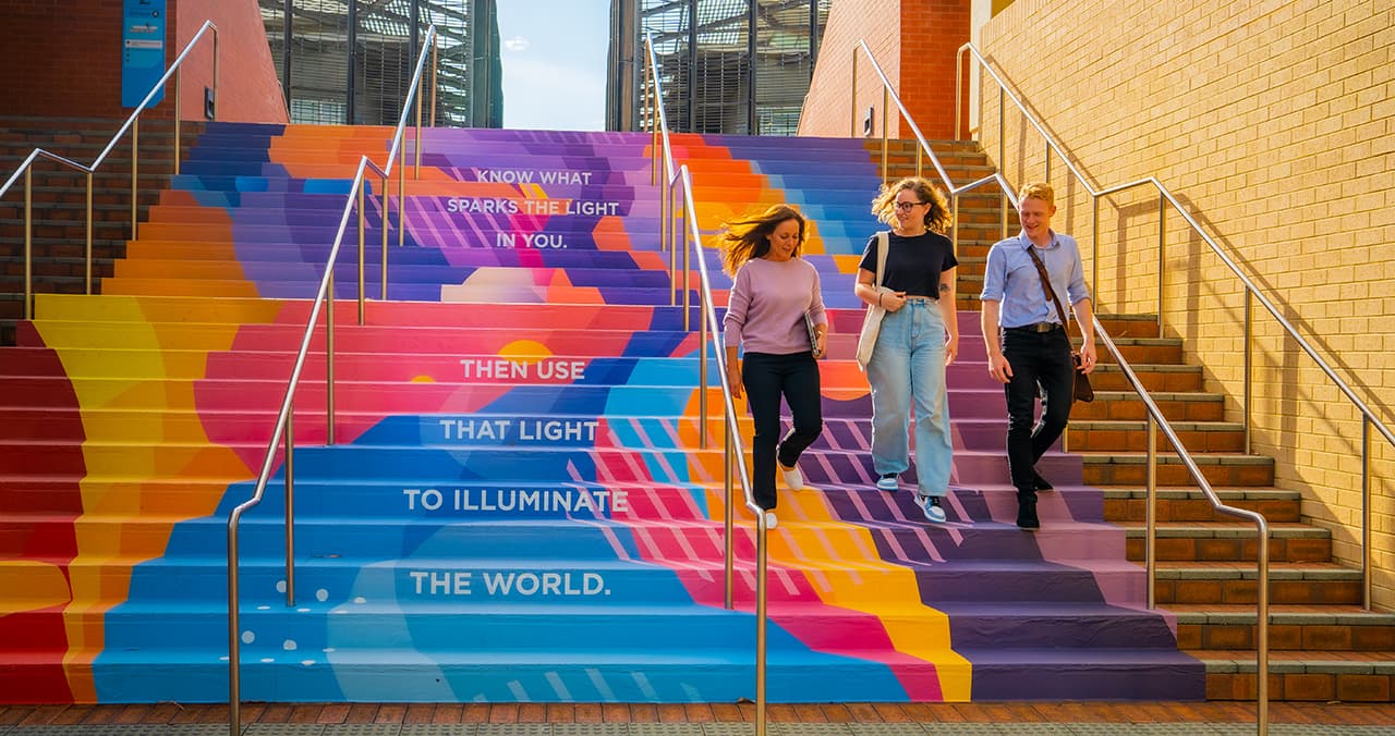 Students walking down brightly painted steps on ECU's Joondalup campus