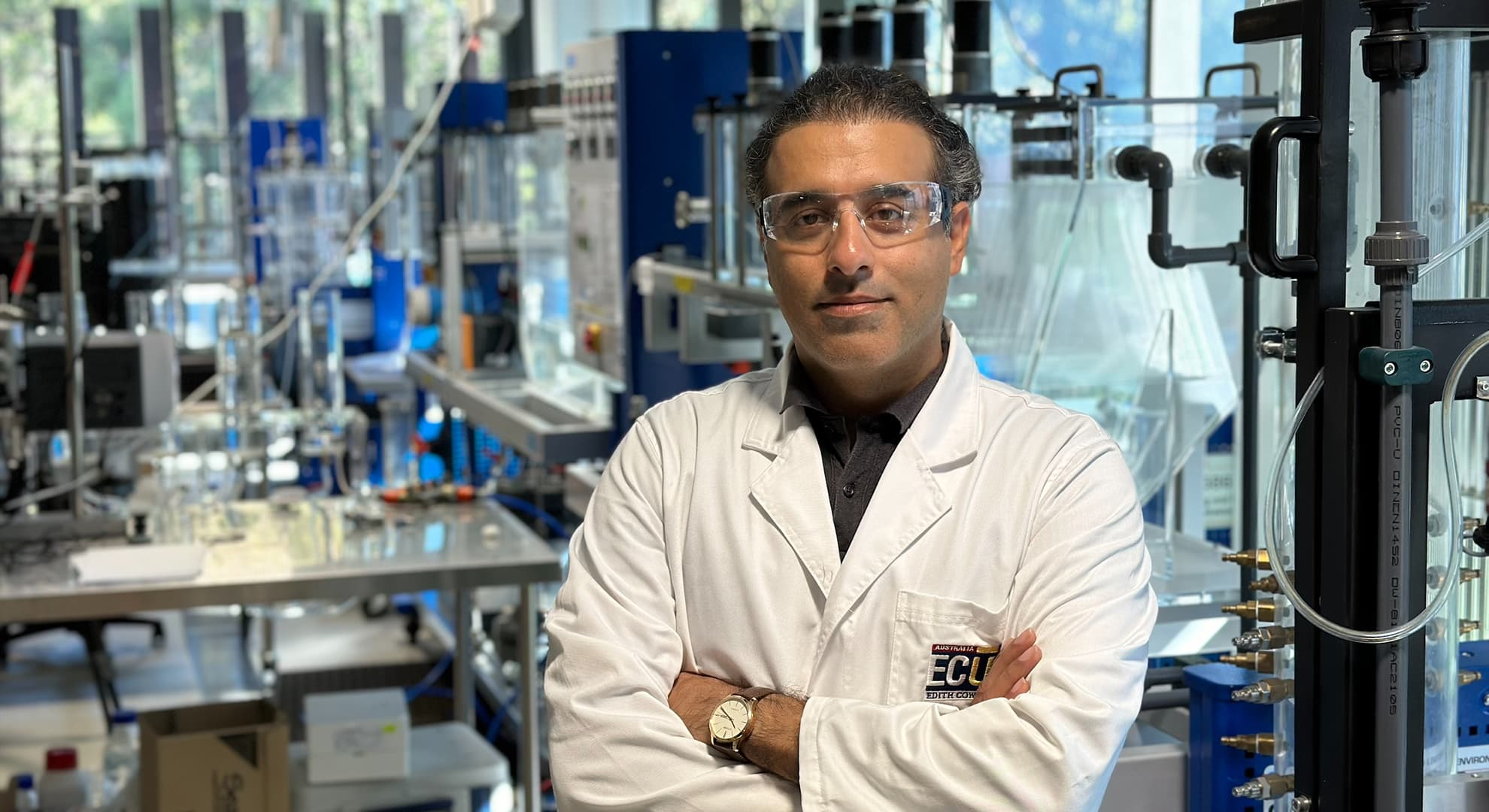 Amir Razmjou standing in lab