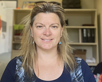 A portrait photo of Mrs Hayley Digney in her office