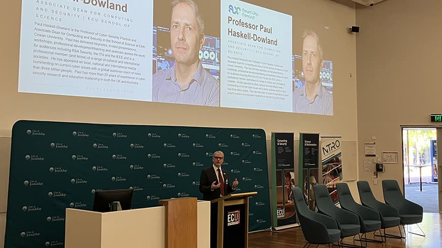 Professor Paul Haskell-Dowland at the lectern giving the sponsor address at a forum.