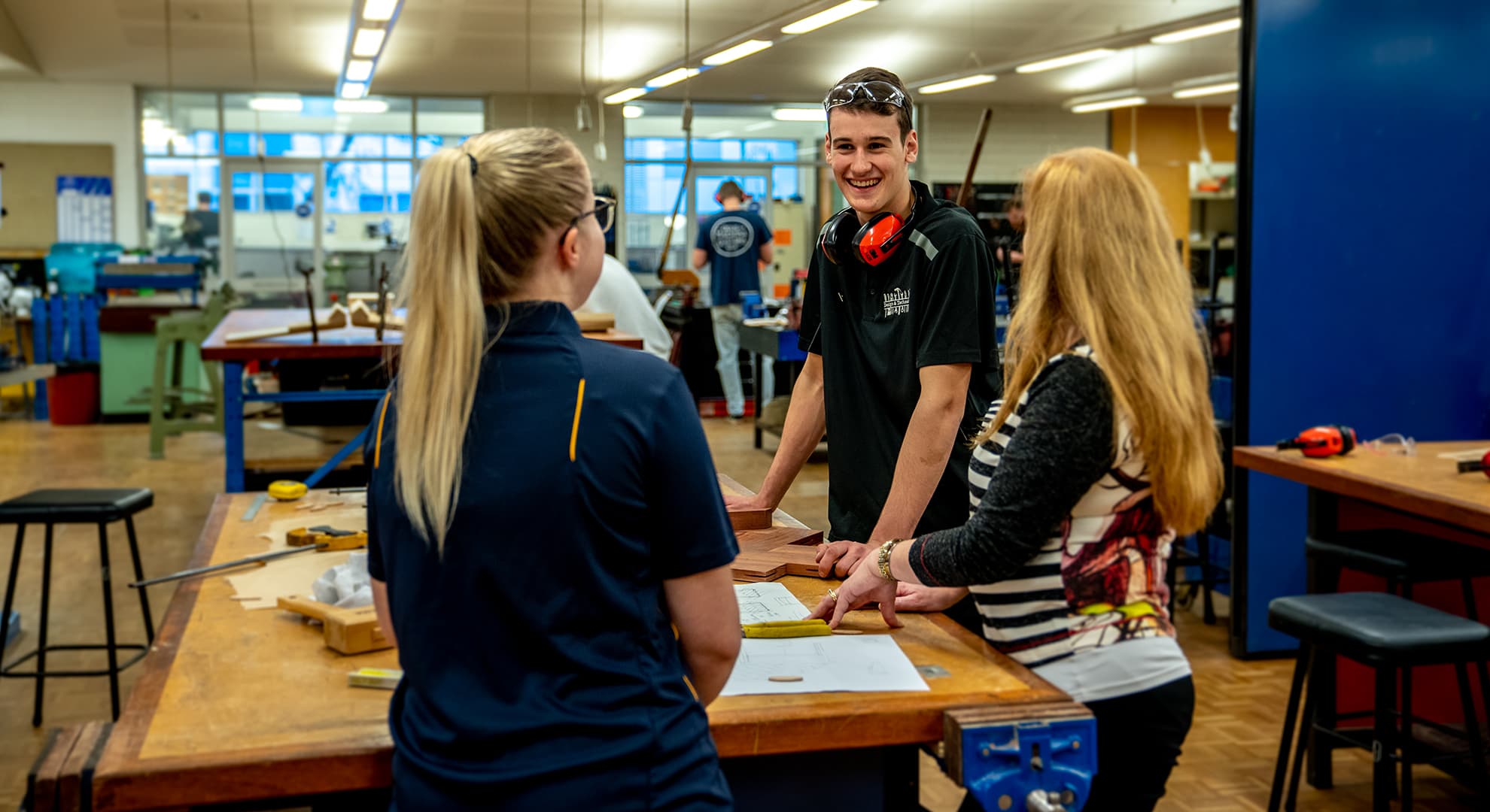 Students and their teacher in a workshop.