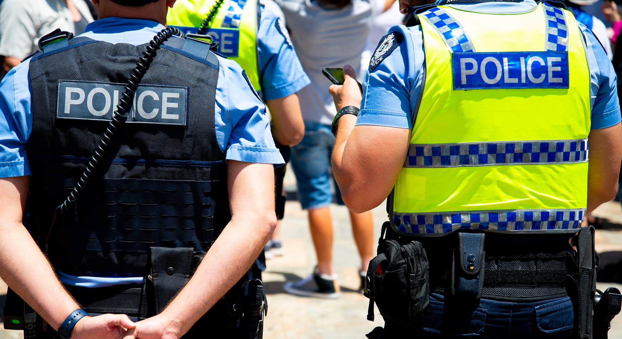 Two police man walking along street