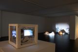 Sculpture and projected artworks on display in gallery exhibition