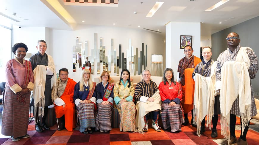 ECU delegates with Her Majesty the Queen Mother Sangay Choden Wangchuck of Bhutan wearing traditional Bhutanese clothing.