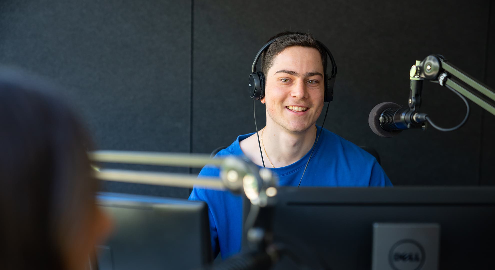 Young man with a microphone.