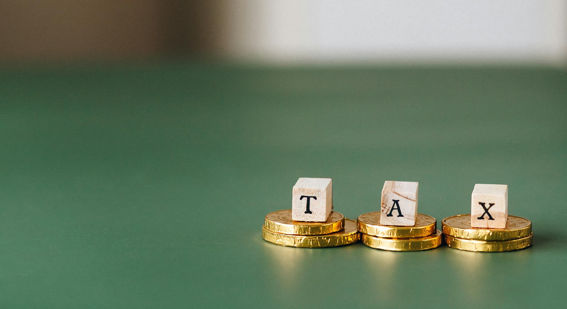 Tiny TAX letters on gold coins