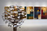 Large artwork sculpture and paintings on display in gallery exhibition