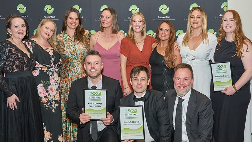 ECU's Communications Centre team, holding awards smiling at the Auscontact Awards 2024