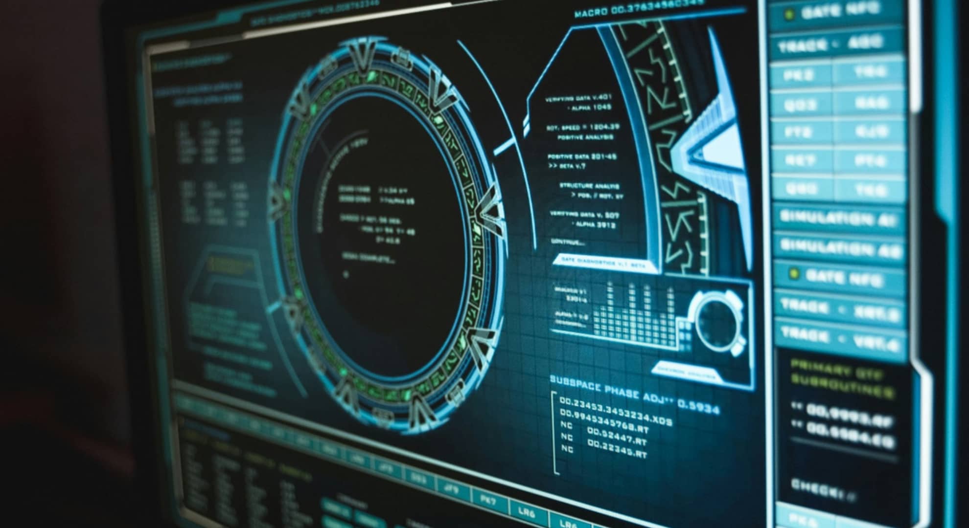 close up colour photograph of computer with black screen with light green and blue complex graphics, large circle of code with side and bottom menus of analytics