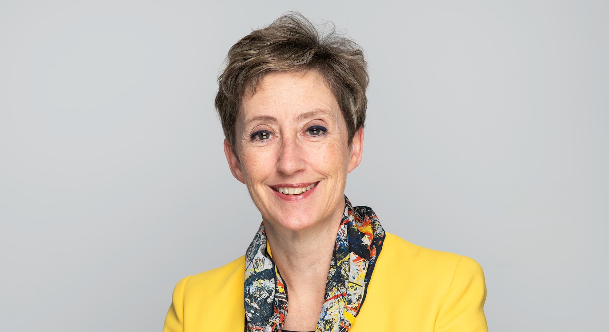 Professor Clare Pollock Vice-Chancellor, Edith Cowan University, in bright yellow jacket