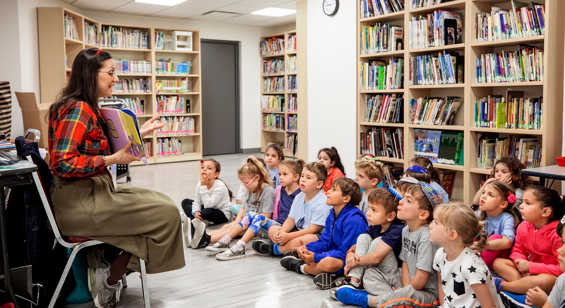 Teacher reading to children in a classroom