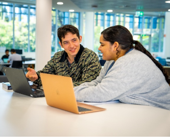 Students enjoy discussing news content accessed on their laptops in the spacious collaborative study space on Lower Level 1 of ECU Joondalup Campus Library.