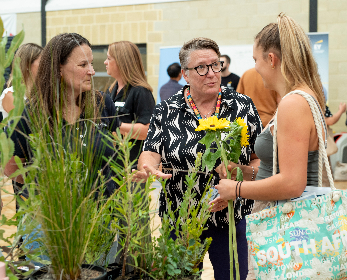 A photo of students interacting with prospective employers.