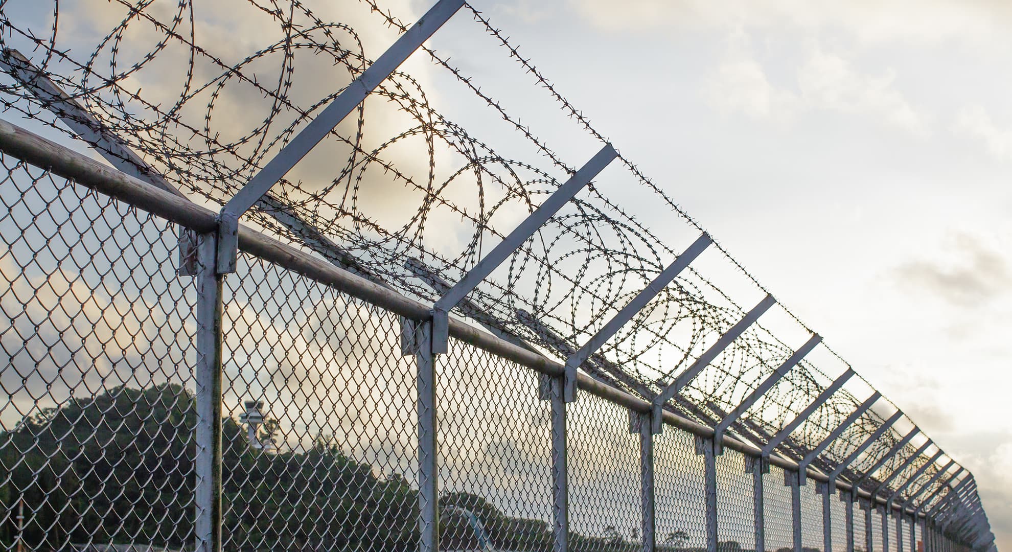 Prison barbed wire fence.