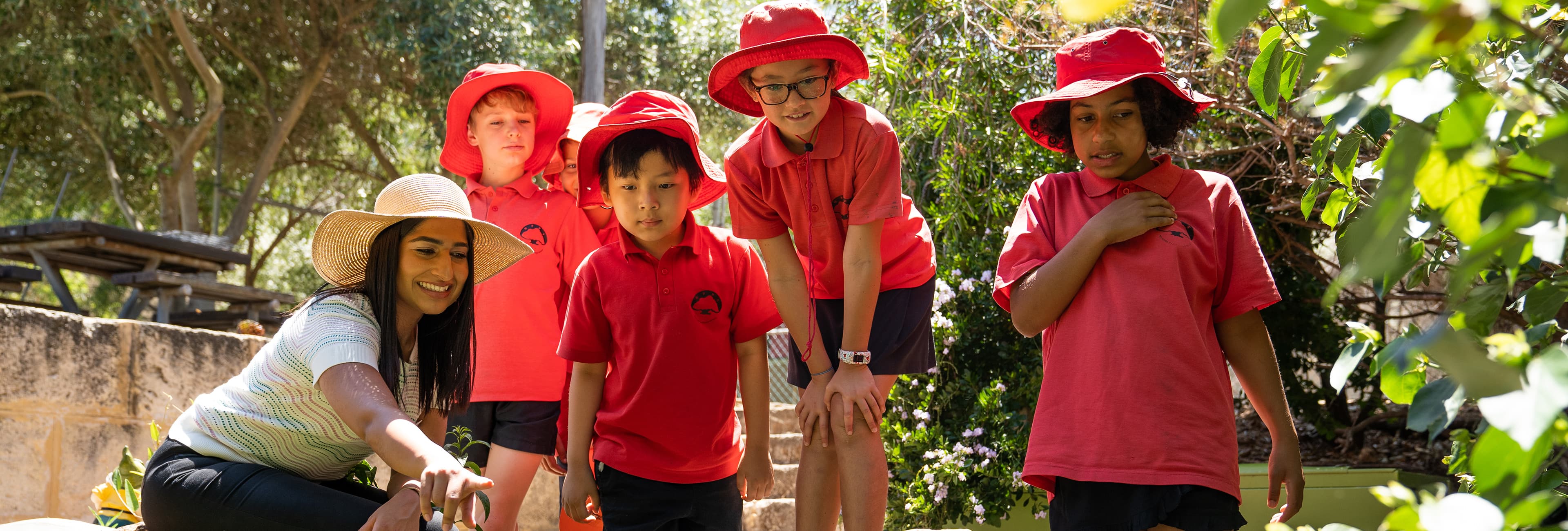 Group of children in school uniform with their teacher