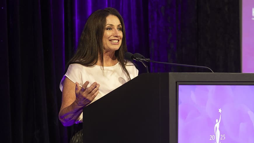 Person making a speech behind a lectern