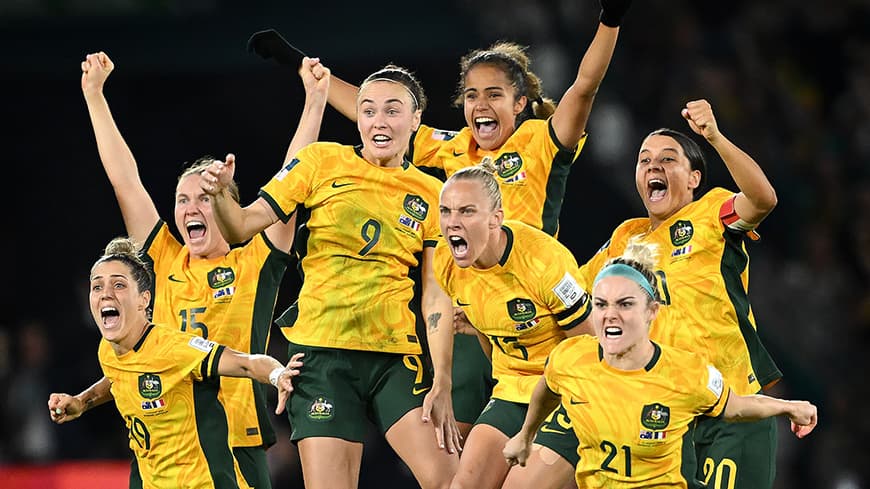 Female soccer players celebrating win