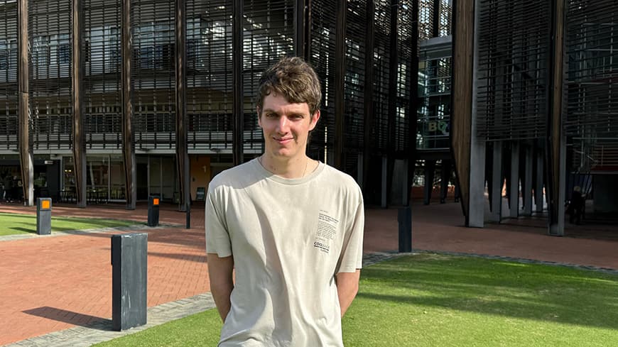 Male student outside a building