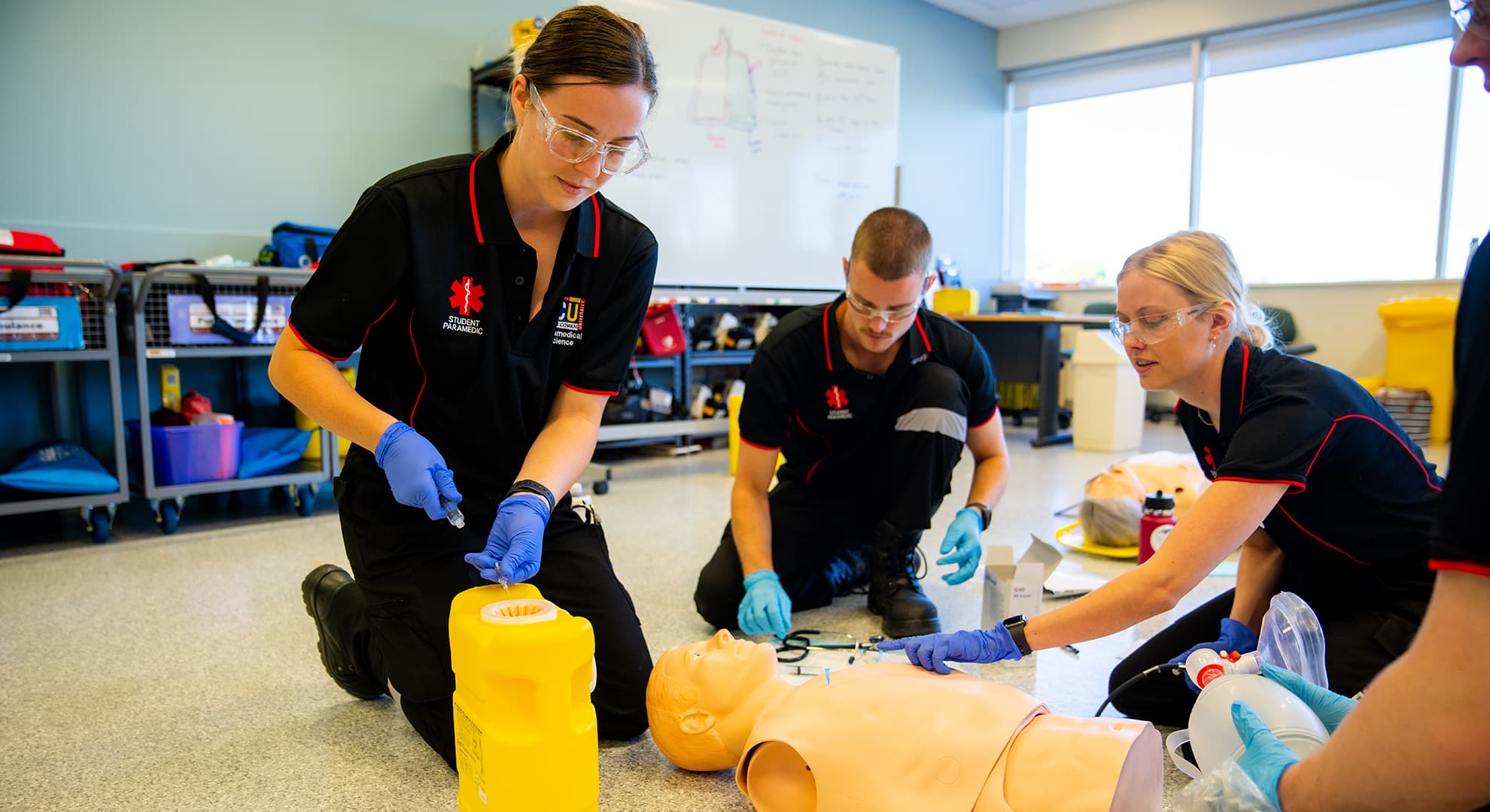 Paramedicine students practicing their resuscitation skills.