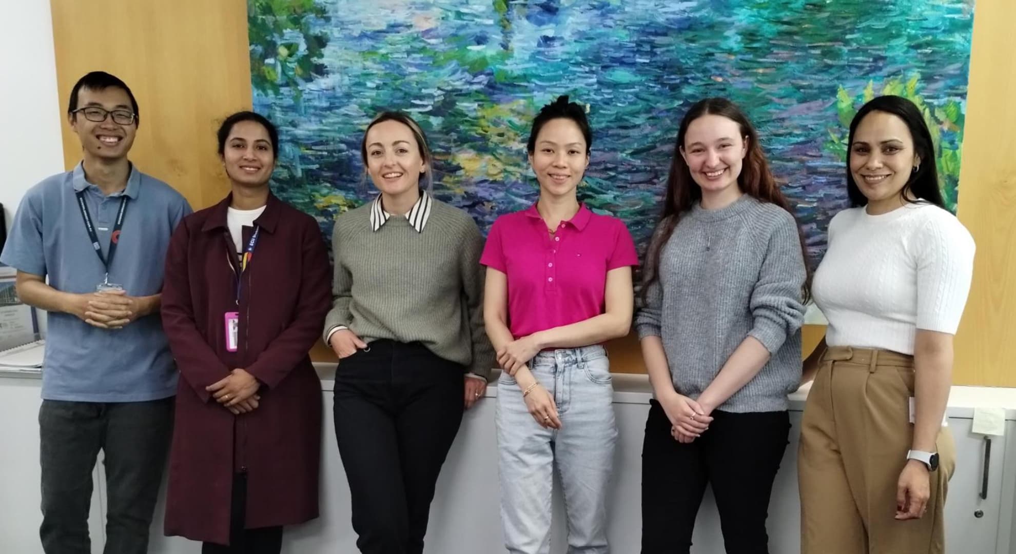 Six ECU counselling students stand in an office.