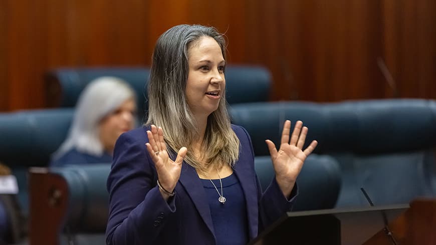 Nathalie Bergon wears a navy jacket and delivers her stump speech in WA Parliament.